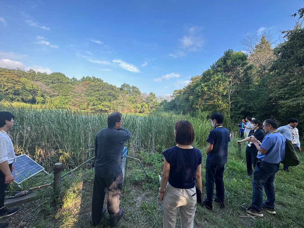Explanation by staff at the NEC Corporation Abiko plant site swamp
